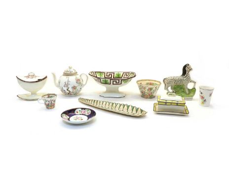 A small collection of creamware, early 19th century, comprising:  a navette-shaped sauce boat, 15cm high, a pair of Wedgwood 