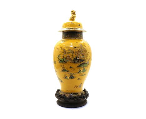 A Wiltshaw &amp; Robinson Carlton Ware urn vase and cover, c. 1920-1926, of baluster form with Chinese landscape decoration o