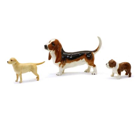 A Beswick model of a Basset Hound, together with a bulldog, and a golden labrador (3)Condition report: All with light surface