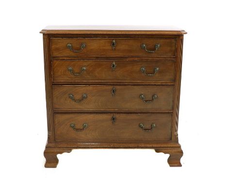A George III and later mahogany chest of drawers, the rectangular top with a moulded and canted edge, above four graduated lo