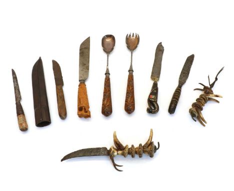 Nine mixed cutlery items, including a pair of unusual antler animal handled carving knife and fork, a pair of salad servers b
