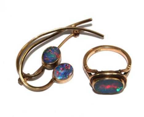 A 9 carat gold ring set with central opal together with an opal set brooch