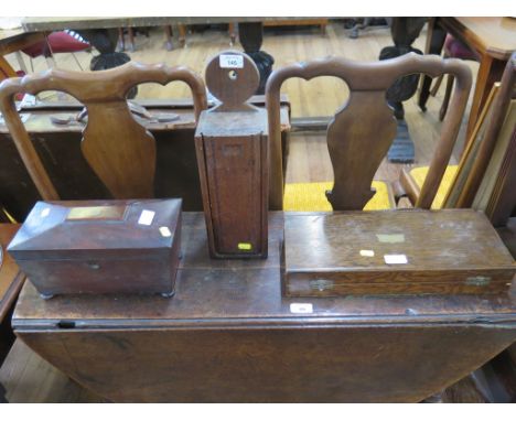 A mahogany sarcophagus form tea caddy on bun feet, 38cm wide, an oak candlebox 39cm high and a oak cutlery box (3)
