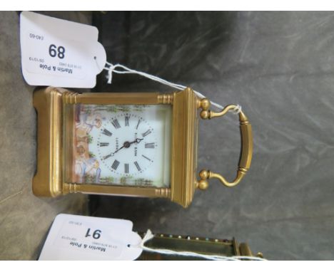 A brass miniature carriage clock by Elliott &amp; Son, London, with enamel panels depicting cherubs catching butterflies 11.5