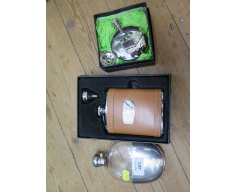 A glass hip flask with plated top and detachable cup base by Walker &amp; Hall together with two others in boxes, each with i