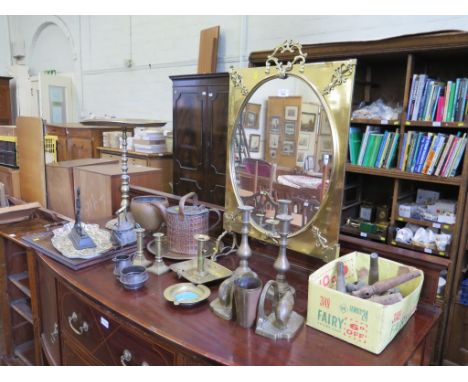 A brass mirrored firescreen, a Regency cast iron doorstep, brass candlesticks, barrel taps and other brassware