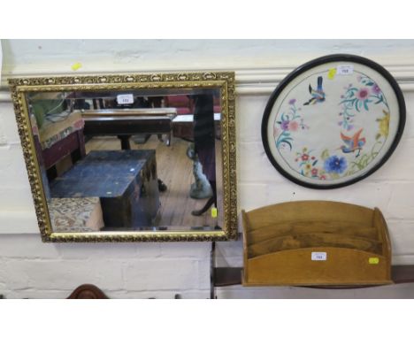 A desktop stationery rack, a giltwood wall mirror, an embroidered circular panel and a travel trunk (4)