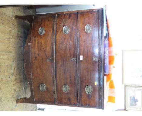 An early 19th century bowfront chest of drawers with three long drawers on outsplayed bracket feet, 90cm wide