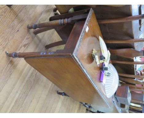 A Victorian mahogany Pembroke table, the rectangular drop leaf top on ring turned tapering legs and brass castors 91cm wide