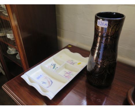 A Poole Pottery brown glazed vase with scroll decoration, initialled A.F. and A.V., 93 31cm high and a Poole Pottery Hors D'o