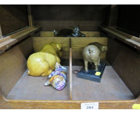 A vintage hand made studio streaked iridescent glass pig money bank together with another three model pigs (4)