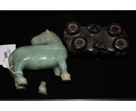 A jade horse, 12.5 cm long,  with a damaged leg, on a hardwood stand