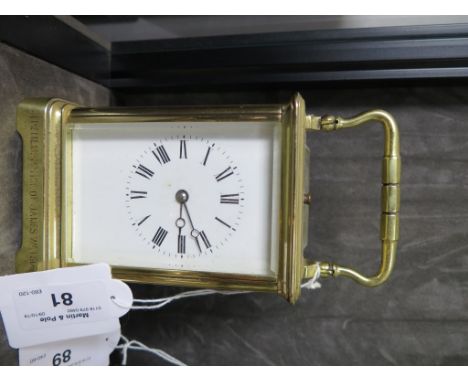A brass carriage clock, engraved 'In remembrance of James Watson', the enamelled dial with a twin train repeat movement strik