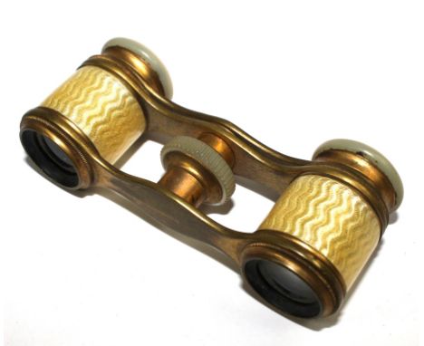 A pair of opera glasses decorated in lemon enamel