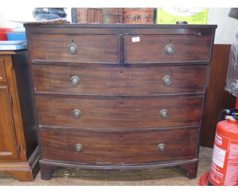 An early 19th century mahogany bowfront chest of drawers, with reeded edge over two short and three long graduated drawers on