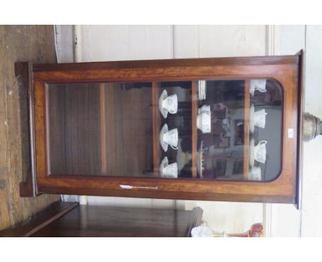 A mahogany bookcase, with adjustable shelves and glazed door on bracket feet, 66.5cm wide, 34cm deep, 132cm high