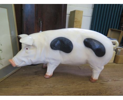 A large resin model of a pig, possibly a shop display 95cm long