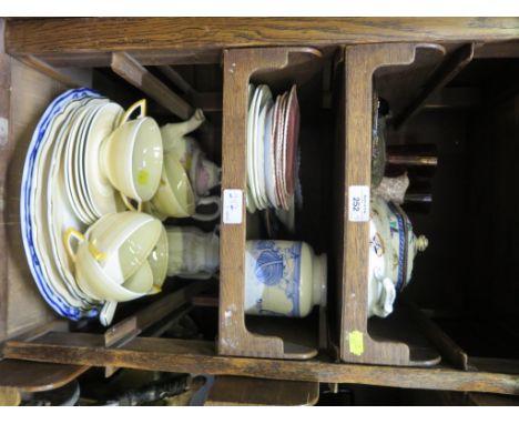 An Art Deco style part tea service, with yellow bands, various plates and saucers, teapot, gothic moulded jug and various gla