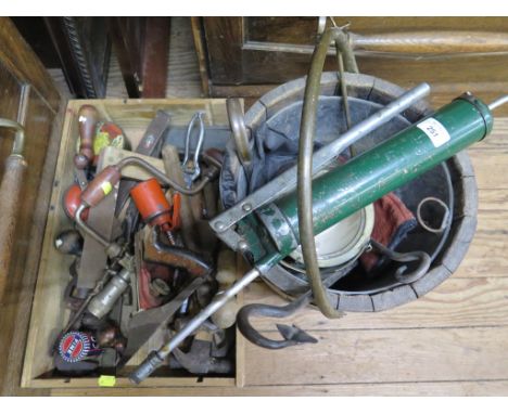 A collection of woodworking tools and barrel form bucket