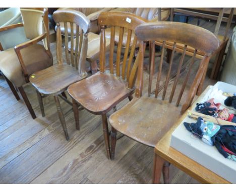 Three ash kitchen chairs, with rail backs, moulded seats and ring turned legs joined by stretchers