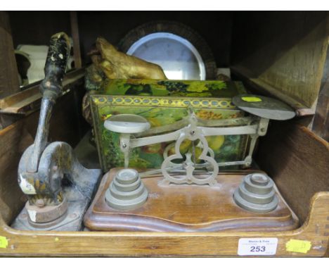 A set of postal scales, a stationery stamp, a seated figure of a cherub, another figure, a small mirror and embroidery