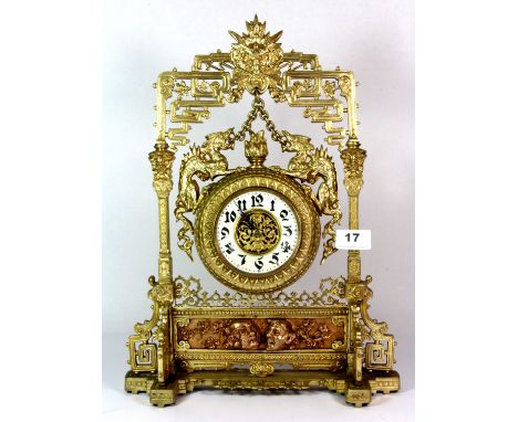 A superb 19th century Orientalist gilt brass mantle clock decorated with dragons, H. 41cm.