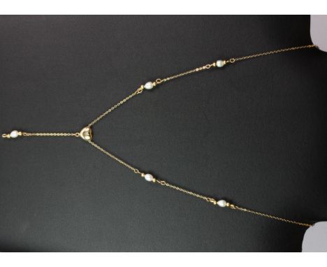 A 14ct yellow gold (stamped 14k)  pearl set necklace.