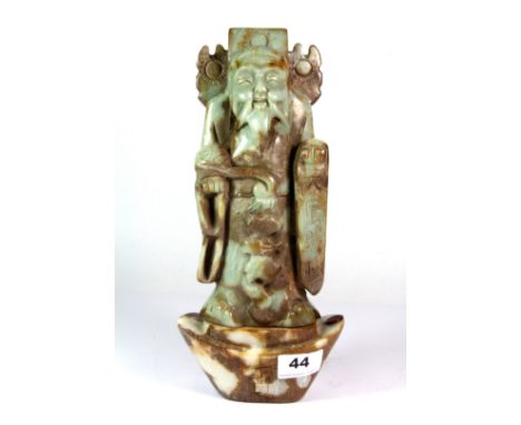 A Chinese carved jade figure of a lucky character, H. 30cm.