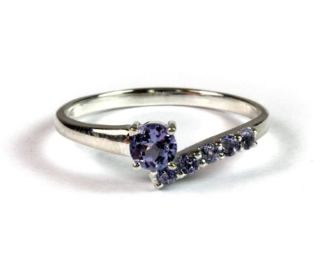 A pretty 925 silver ring set with mauve tanzanites (R).