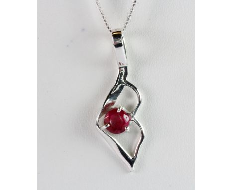 A 925 silver ruby set pendant and chain.
