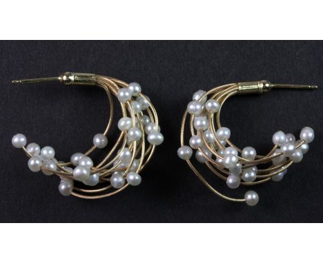 A pair of 9ct yellow gold (stamped 375) pearl set earrings.