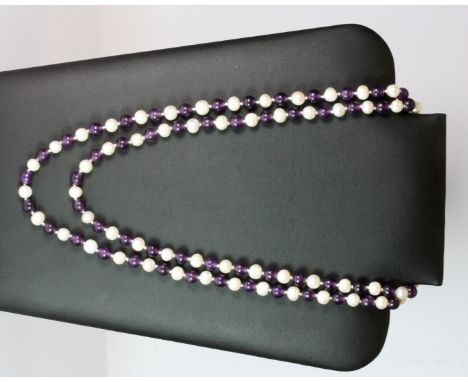 An amethyst bead and pearl necklace.