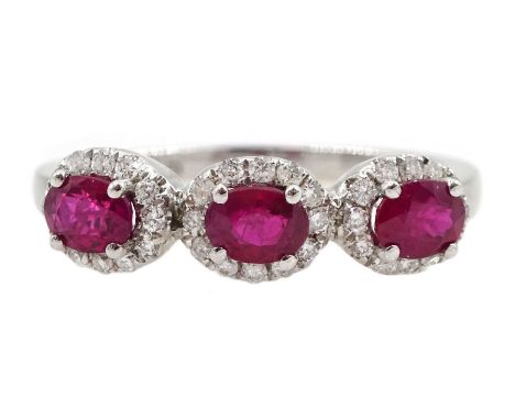 White gold three stone oval ruby and round brilliant cut diamond cluster ring, hallmarked