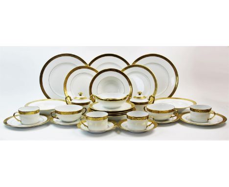 An extensive Limoges part dinner service, 20th century, comprising; 15 twin handled soup bowls, 17 soup bowl stands, 14 side 