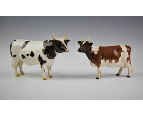 A Beswick Ayrshire bull and cow, the bull marked 'CH Whitehill Mandate', model No. 1454B, the cow marked 'CH Ickham Bessie', 