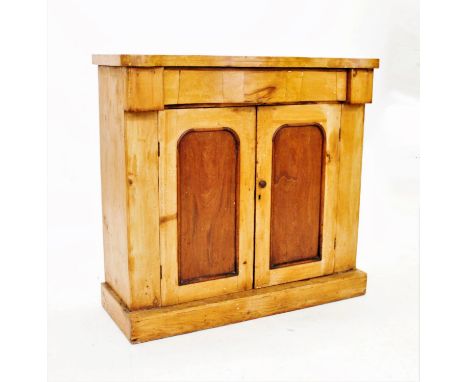 A Victorian pine side cabinet, with a serpentine frieze drawer above a pair of cupboard doors, 86cm H x 90cm W x 37cm D, alon