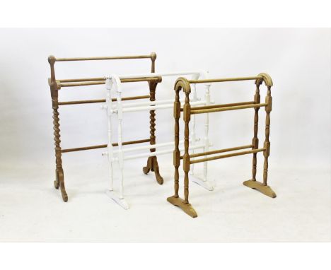 Three Victorian style beech wood towel rails, including a painted example, along with a Victorian pine hanging wall shelf, wi