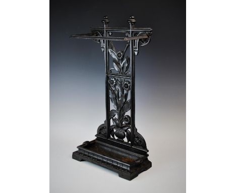 A Victorian style painted metal stick stand, with a cast openwork foliate rear panel above a removable tray, 64cm high 