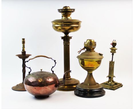 A Victorian brass Corinthian column oil lamp, 50cm high, a 19th century brass table lamp with reeded column upon four dolphin