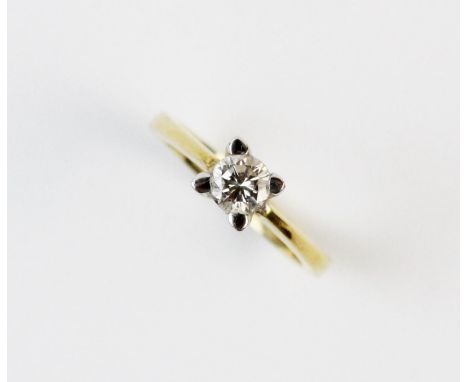 A diamond solitaire ring, the central brilliant cut diamond measuring approx. 0.25ct, claw set in white metal, continuing to 