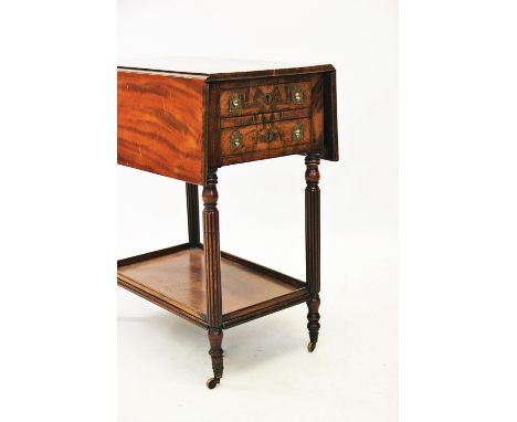 A mid 19th century mahogany work table in the manner of Gillows, the rectangular hinged top above two drawers applied with ca