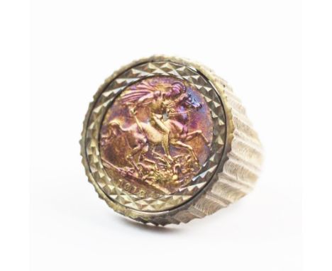 A sovereign set 9ct gold dress ring, the George V sovereign dated 1912, set to a raised textured mount, continuing to a plain