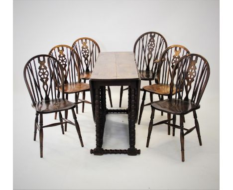 An 18th century and later drop leaf oak dining table, the oval top raised upon bobbin turned legs and cross stretchers, 77cm 