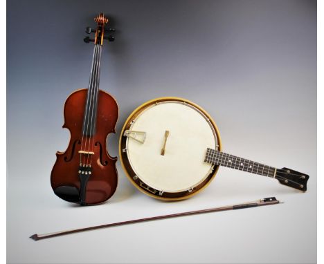 A four string banjo ukulele, with beech wood neck, the body attached to a circular tray back, 60cm long, with outer case, alo