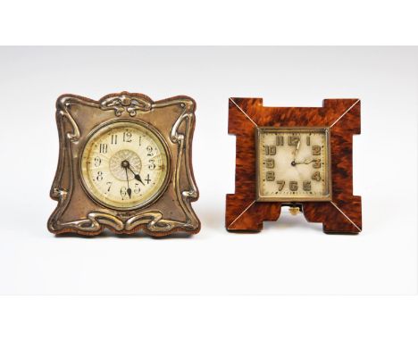 An Art Nouveau silver mounted travelling clock, Joseph Gloster Ltd, Birmingham 1905, with sinuous flowing design and black Ar