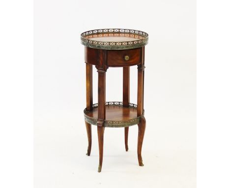 A Regency style mahogany sewing table, the glazed needlework top above a sliding linen box, raised upon lyre shaped supports,