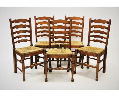 A set of ten 18th century style honey oak ladder back dining chairs, 20th century, each chair with five graduated shaped rung