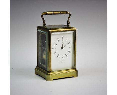 An early 20th century lacquered brass cased carriage clock, with a 7cm white enamelled dial, indistinctly signed by a Manches