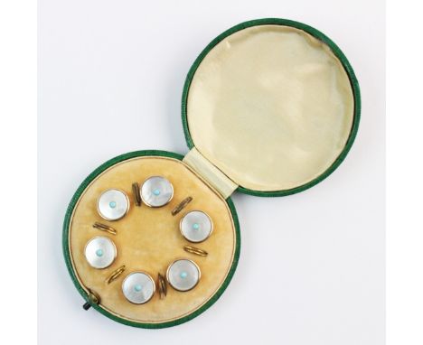 A set of six mother of pearl and turquoise buttons, each round button comprising a mother of pearl disc with a small turquois