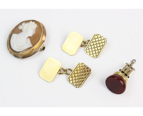 A pair of 9ct gold cufflinks, the rectangular form cufflinks with truncated corners and engraved decoration, marked for Birmi
